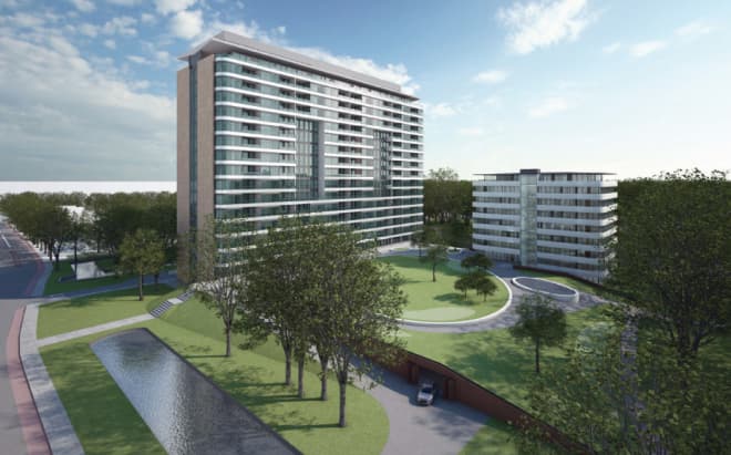 Moderne appartementencomplexen in een groene parkomgeving met een vijver.
